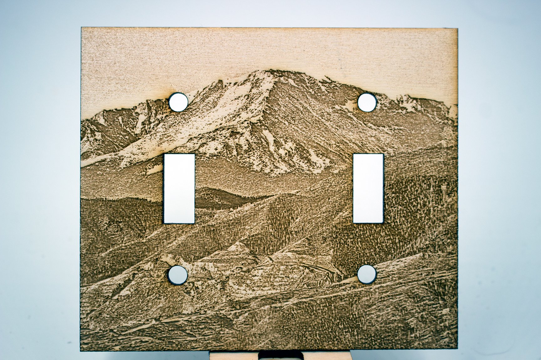 Double light-switch plate engraved with a view of Pikes Peak